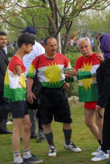 Three heroes in Kurdish flags.